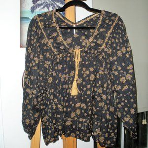 Free People peasant style blouse , tassel tie, see through accents.